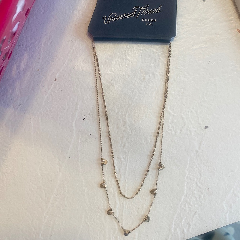This Universal Thread’s necklace is gold.
